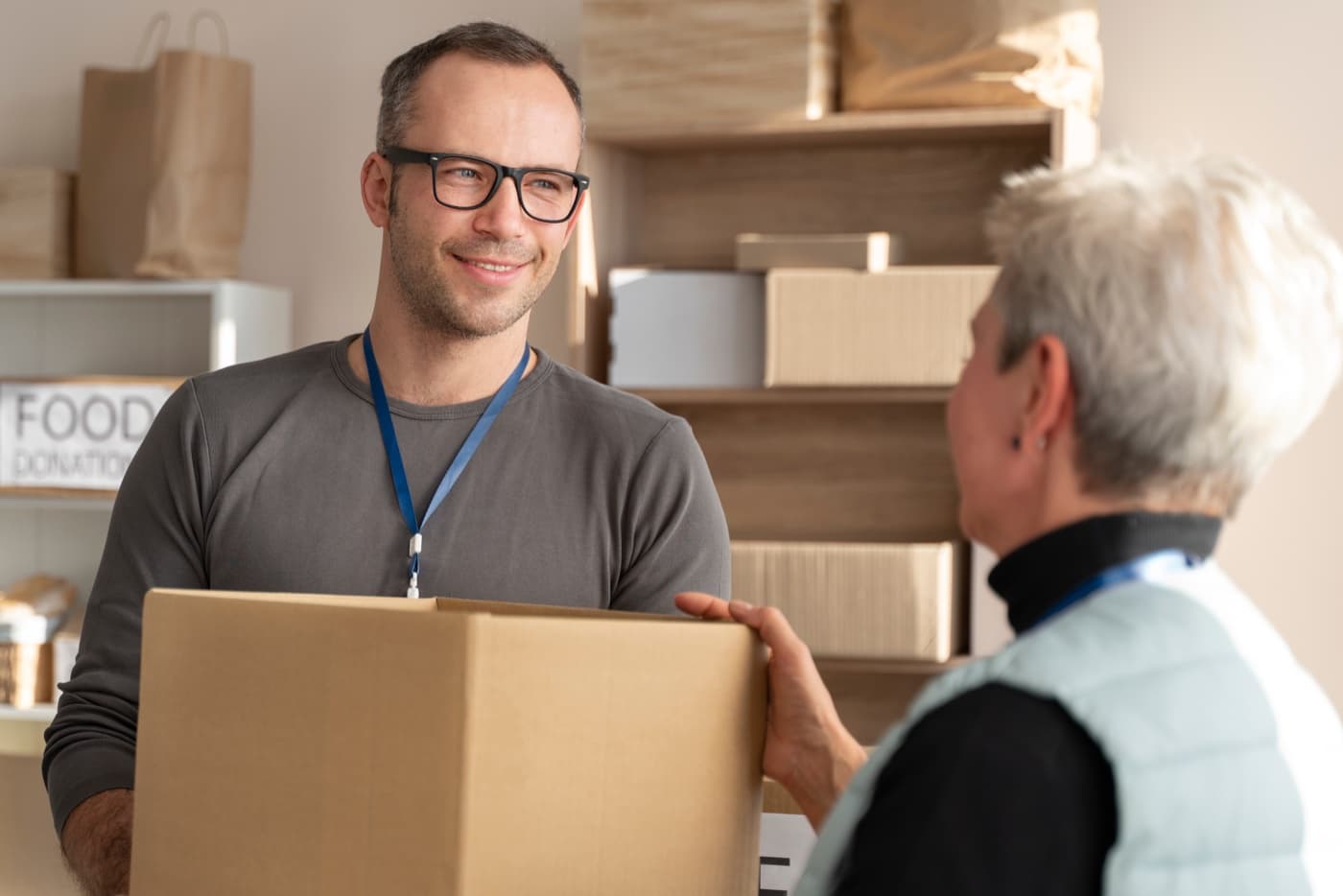 Courier handing a parcel to a customer