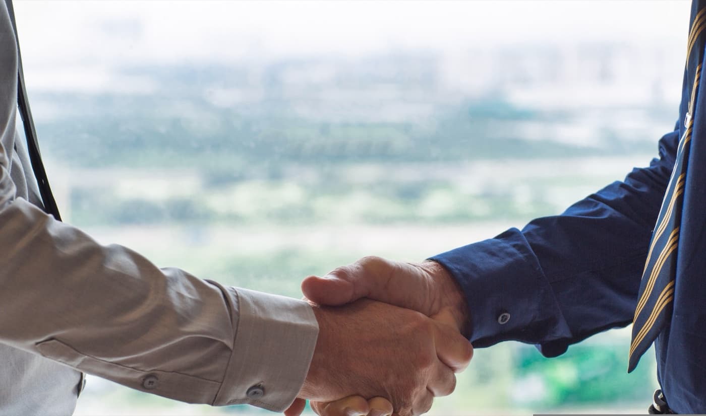 Two business partners shaking hands